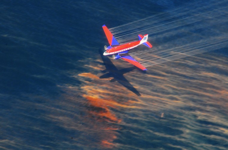 Image: The crew of a Basler BT-67 fixed wing aircraft release oil dispersant over an oil discharge from the mobile offshore drilling unit, Deepwater Horizon, off the shore of Louisiana