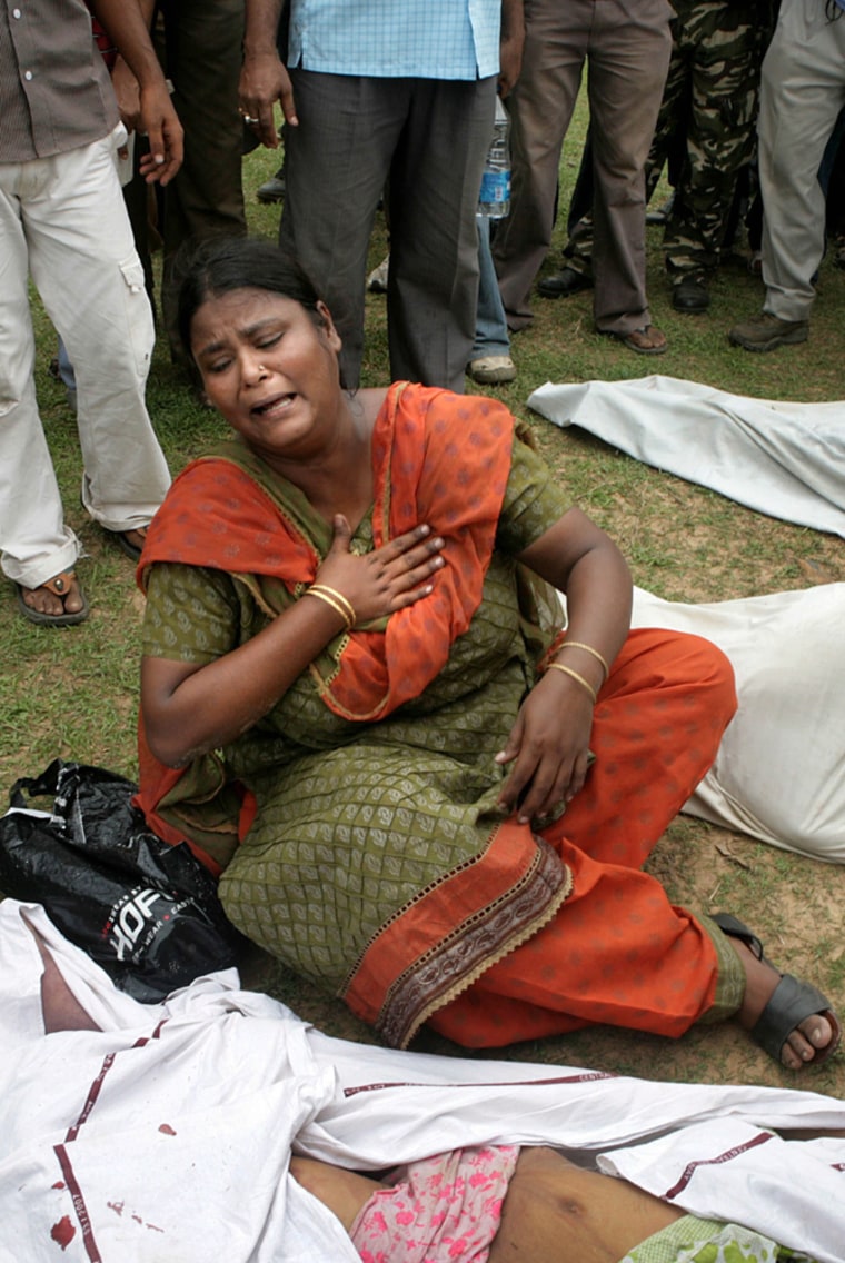Image: A dead body shows in a damage train compartment