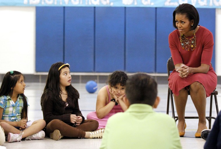 Image: Michelle Obama talks with students