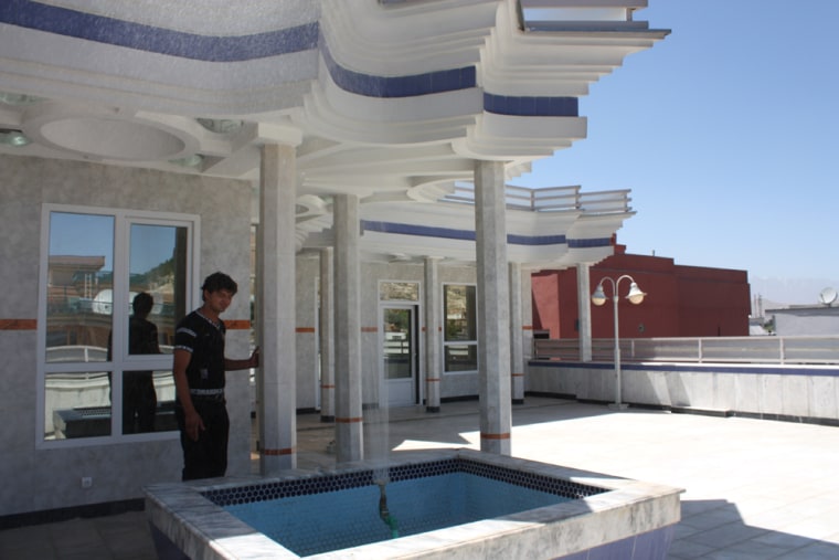 Image: Property dealer Zamani Nawid shows off the rooftop fountain