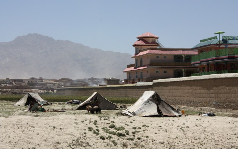 Image: Nomads have set up camp next to the the compound