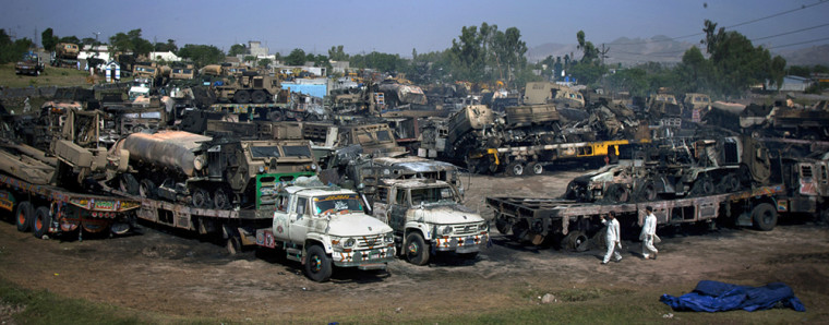 Image: Burnt trucks torched by suspect militants