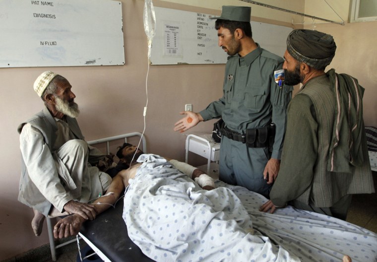 Image: Injured man at a hospital following a blast in Kandahar city