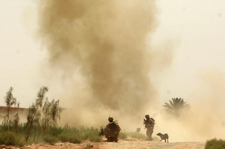 Image: U.S. Marines from 3rd Battalion, 6th Marines look on as an IED explodes while they are on a patrol in Marjah district