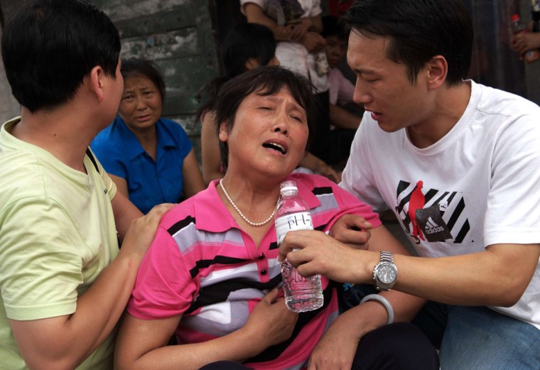 Image: Relative of a dead miner grieves