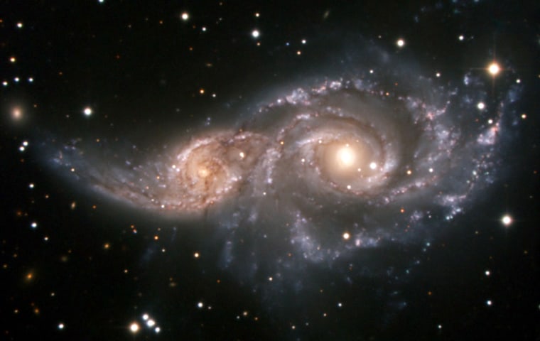 Galaxy mergers — here shown is the system NGC 2207 in the constellation Canis Major — are the most likely reason why active galactic nuclei occur. 
