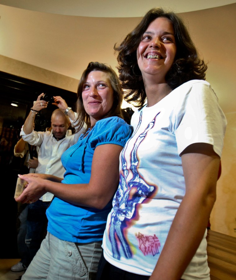 Image: Teresa Pires (R) and Helena Paixao (L) are pose after getting married at the Civil Court in Lisbon on June 7, 2010, becoming the first gay couple to marry in Portugal