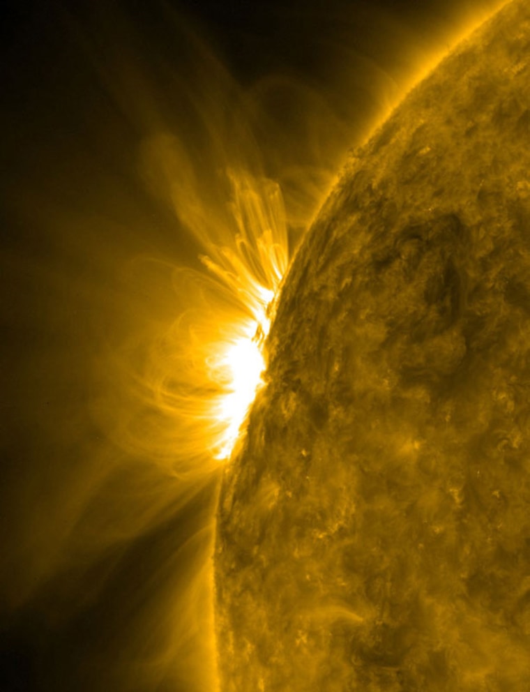As the arcing loops above an active region began to rotate into a nice profile view, NASA's Solar Dynamics Observatory captured the dynamic, magnetic struggles taking place below.