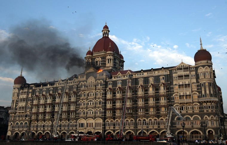 Image: Flames rush out of the Taj Mahal Hotel in Mumbai, during an attack by terrorists