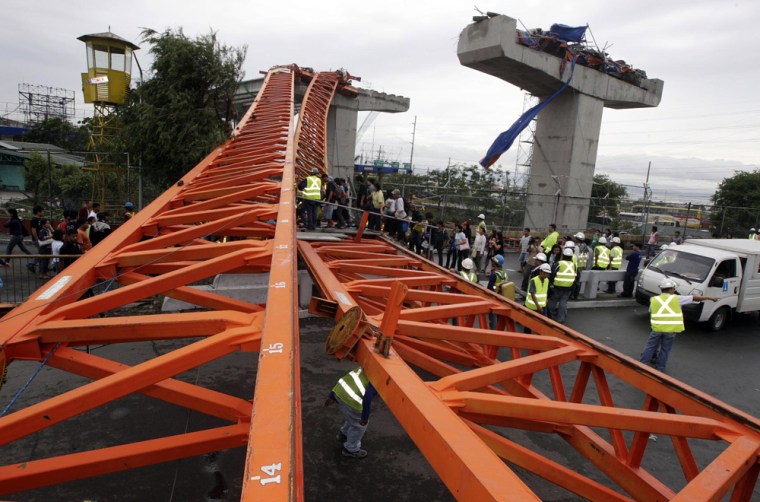 Image: A collapsed crane brought down by strong winds from Typhoon Conson
