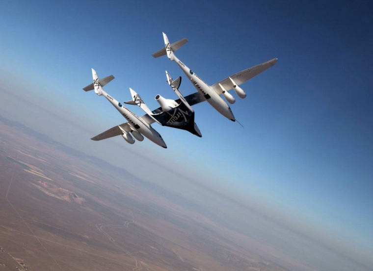 The Virgin Galactic suborbital spaceliner SpaceShipTwo makes its first crewed flight on July 15, 2010 over the Mojave Desert in California, one of a series of test flights before the first flight of the passenger ship for space tourism flights.
