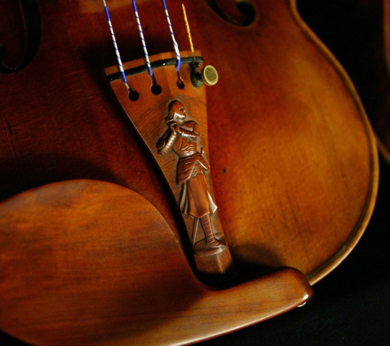4/9/2007
caption: David Fulton's collection of violins includes 7 Stradivarius models. The 1709 La Pucelle Stradivarius is in immaculate shape, having been sequestered from the world for most of its life. It features a hand-carved Joan of Arc.

credit: Special to MSNBC for one-time, non-exclusive use use with an article on msnbc.com. Permission is for editorial usage only and is not to be used for advertising purposes. ÊDigital manipulation, outside normal cropping and color correction, is prohibited. Use of text dropped in over the photo is prohibited. If you wish to use this photo in derivative works, ancillaries, other formats and media, please contact us with details of your proposed reuse. We grant licenses on a per use basis. Mandatory credit to Greg Gilbert / The Seattle Times.