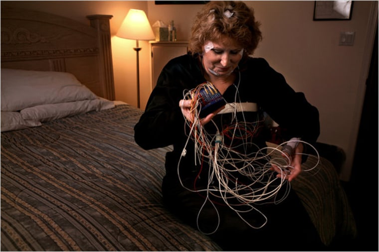 Image:  Marcia Naughton, who has post-traumatic stress disorder, was wired with sensors before going to bed at the clinic.