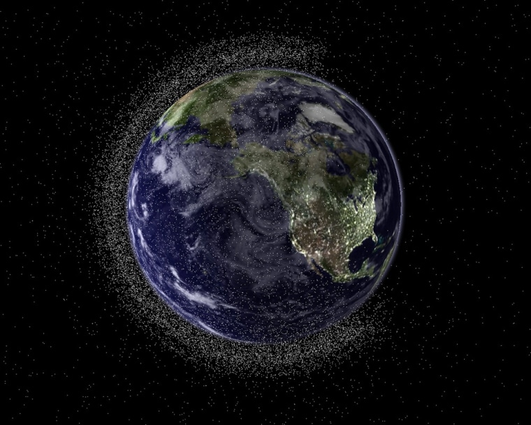 Image: Earth shown from space surrounded by debris