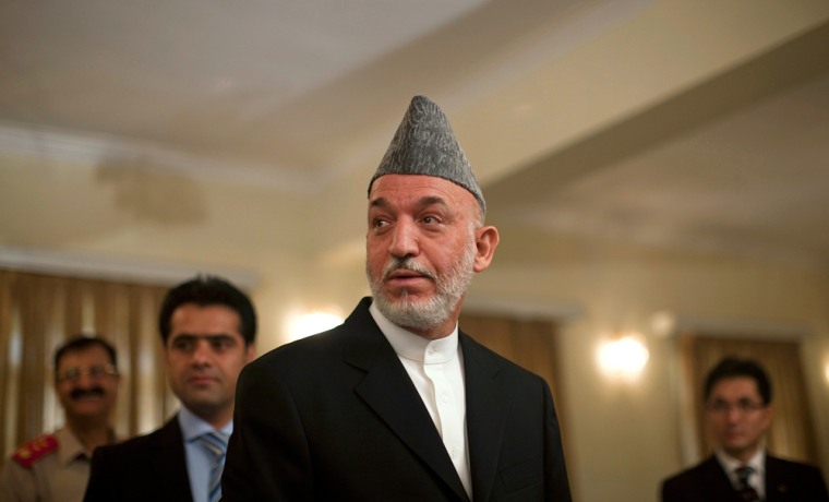 Image: Afghan President Karzai after a news conference in Kabul