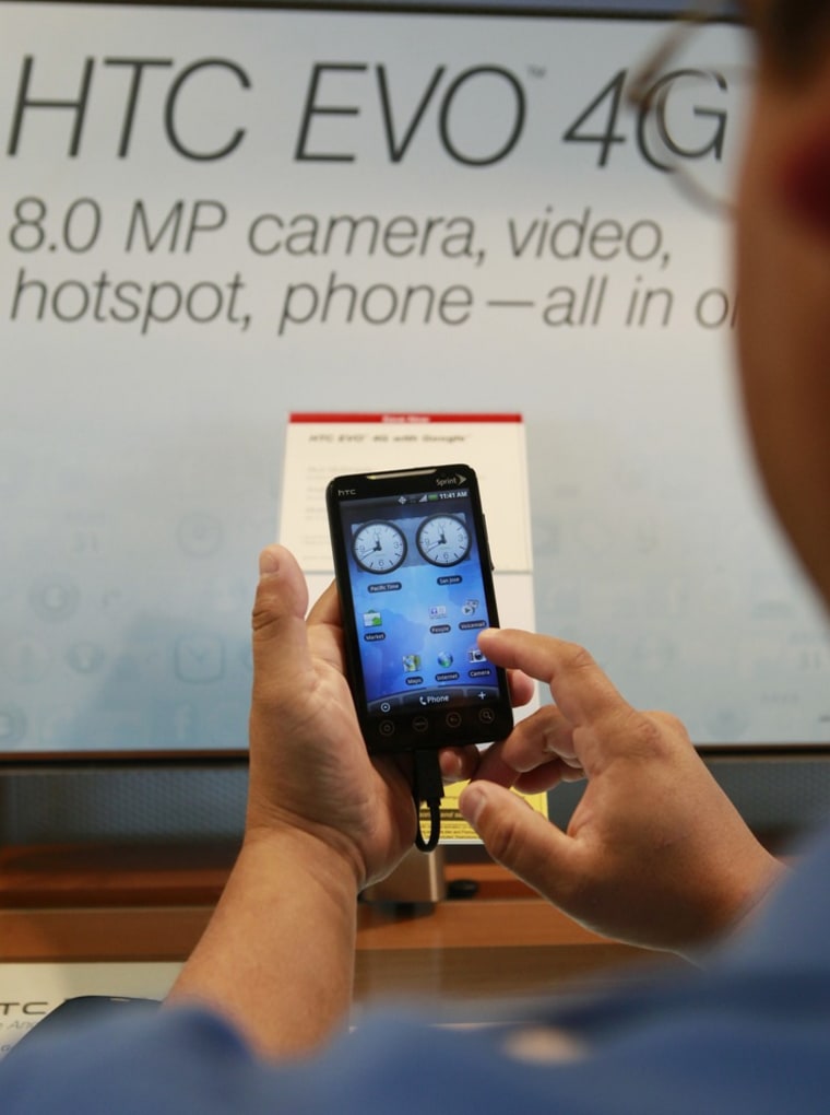 Image: A customer handling a Sprint HTC Evo smart phone