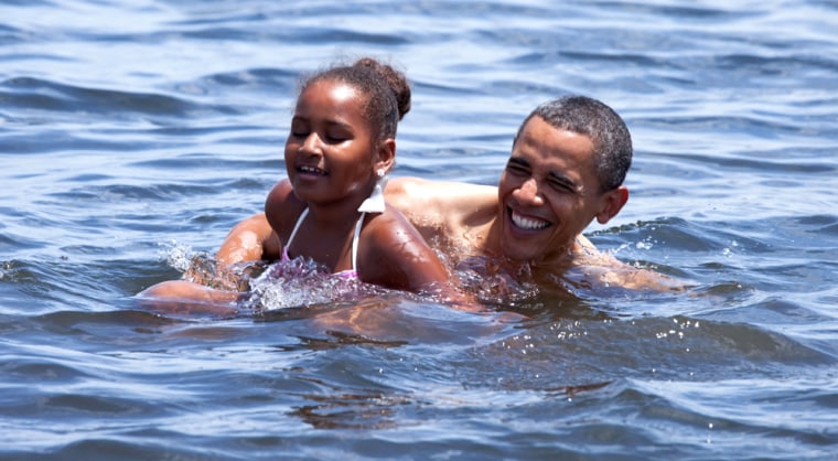 Image: Barack Obama and his daughter, Sasha, swim in Panama City Beach, Fla.