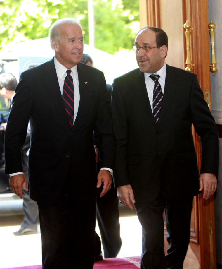 Image: Iraq's Prime Minister Nuri Al-Maliki walks beside U.S. Vice President Joe Biden in Baghdad