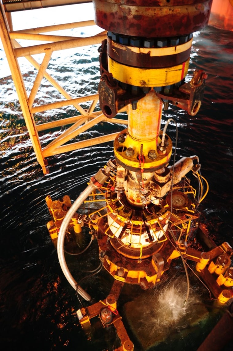 Image: The damaged blowout preventer from the Deepwater Horizon oil rig is extracted by the Q4000 vessel from the Gulf of Mexico
