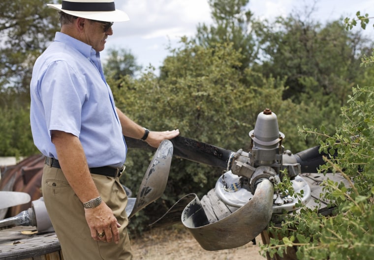 William Waldock, professor of safety science, examines the blades of an airplane propeller at Embry-Riddle Aeronautical University in Prescott, Ariz. The propeller is from the wreckage of a plane that went down in Montrose, Colo., in 1997. (Photo by AJ Maclean/News21)