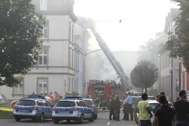 Image: Firemen extinguish flames at the Elisabeth hospital