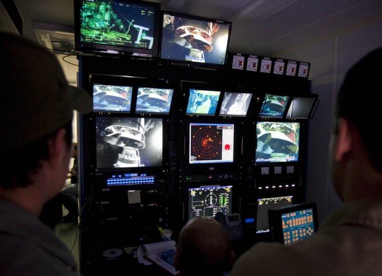 Image: BP pilots work in the Remotely operated vehicles control station onboard Discoverer Inspiration in the Gulf of Mexico