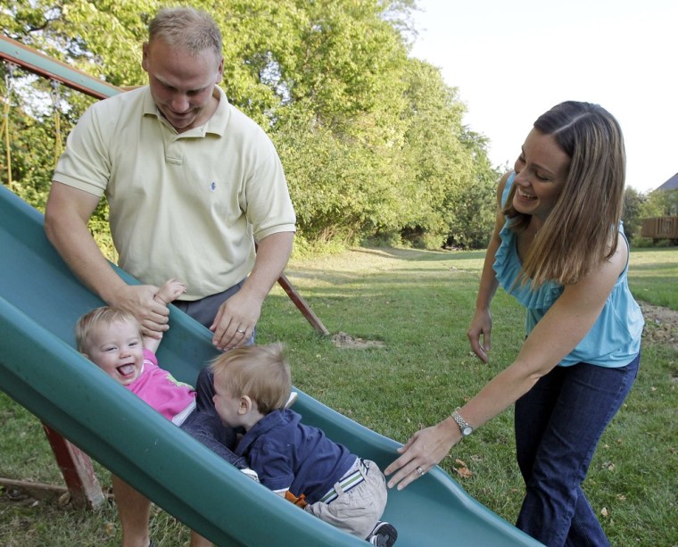 Image: Corey and Lindsey Groepper play with their one-year old twins