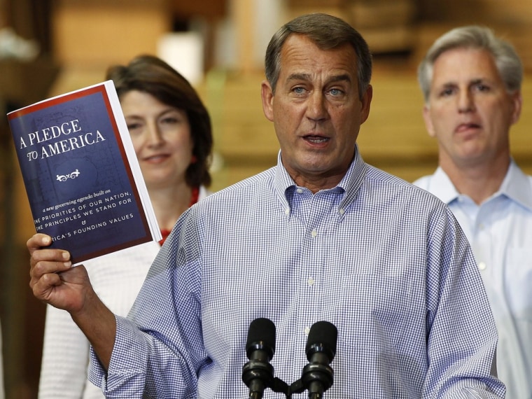 Image: House Republican leader Boehner holds a copy of \"A Pledge to America\" in Sterling