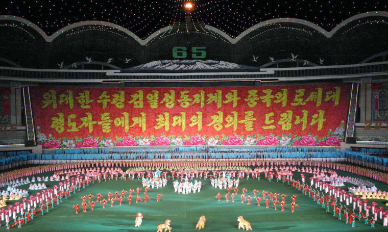 Image: North Koreans perform Arirang Mass Games' chapter 5, named \"Goodwill Arirang\" in Pyongyang in this photo released by North Korea