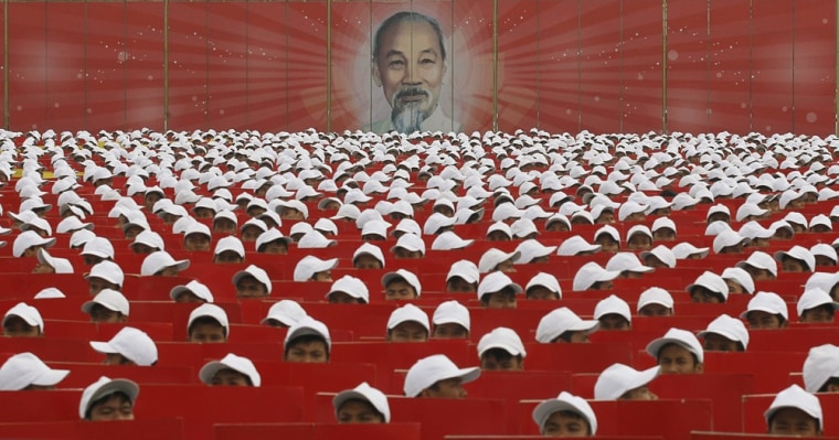 Image: The image of late revolutionary leader Ho Chi Minh is displayed during a military parade at Ba Dinh Square celebrating the 1,000th anniversary of the founding of Hanoi