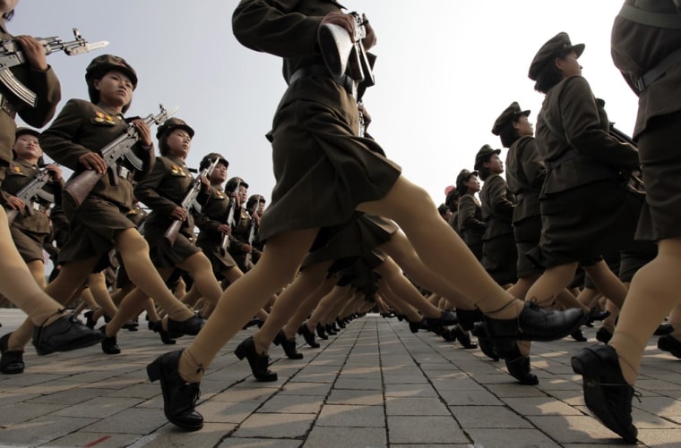 Image: Female North Korean soldiers march during a military parade to commemorate the 65th anniversary of founding of the Workers' Party of Korea in Pyongyang