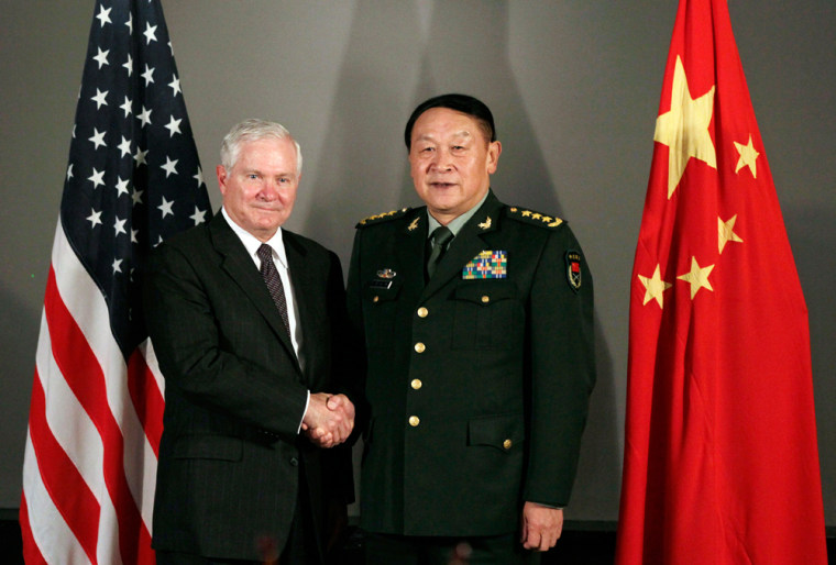 Image: US Defense Secretary Robert Gates and China's Defence Minister Liang Guanglie shake hands before their meeting in Hanoi.