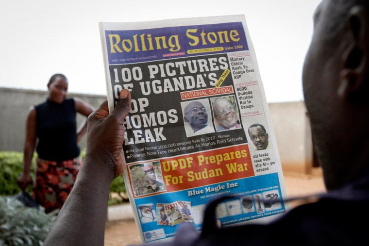 Image: A Ugandan man reads the headline of the Ugandan newspaper \"Rolling Stone\" in Kampala, Uganda
