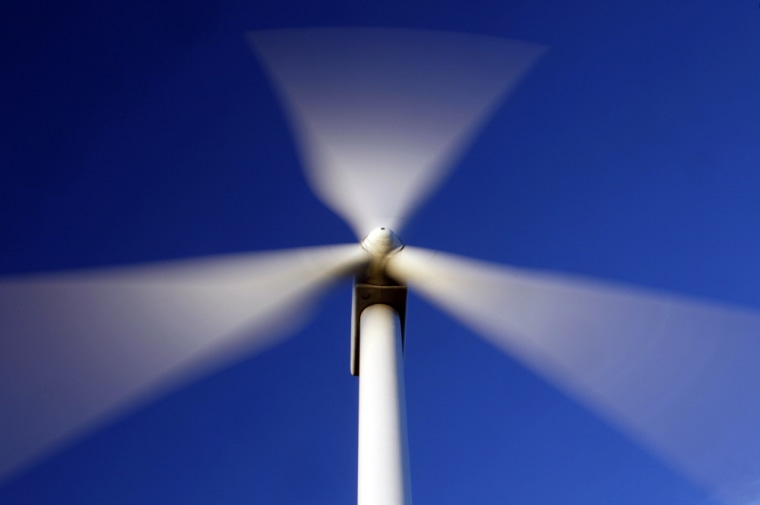 Image:  Blades of windmill blur as they catch the wind on Stetson Mountain in Range 8, Township 3, Maine