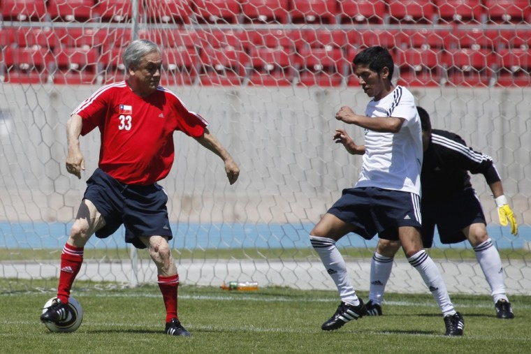 Image: Chile's president plays soccer with miners