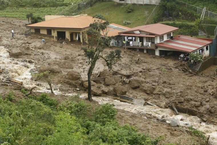 Image: A general view of houses damaged by a landslide in San Antonio de Escazu near San Jose