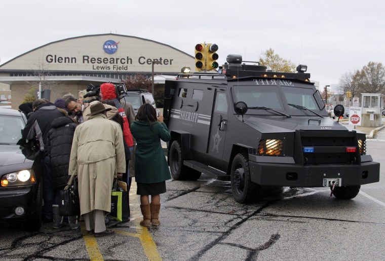 Image: A Cuyahoga County Sheriff's armored vehicle leaves the NASA Glenn Research Center in Brook Park, Ohio