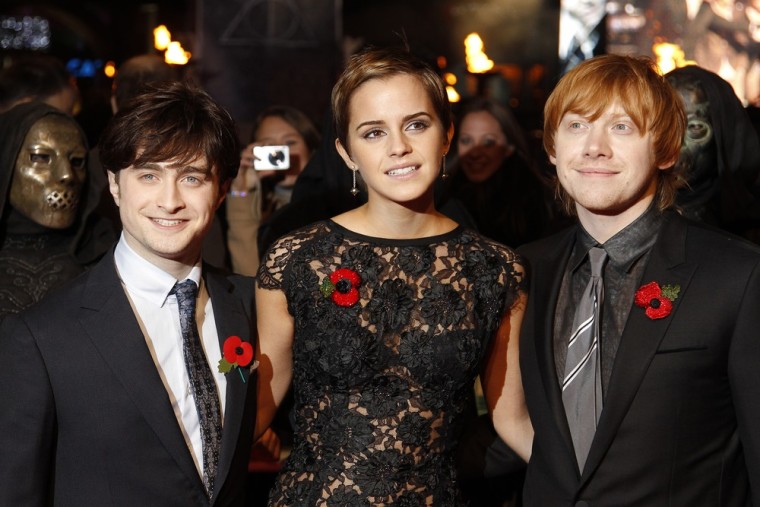 Image: Britain's Watson with Radcliffe and Grint poses as they  arrive for the world film premiere of \"Harry Potter and the Deathly Hallows: Part 1\" in London