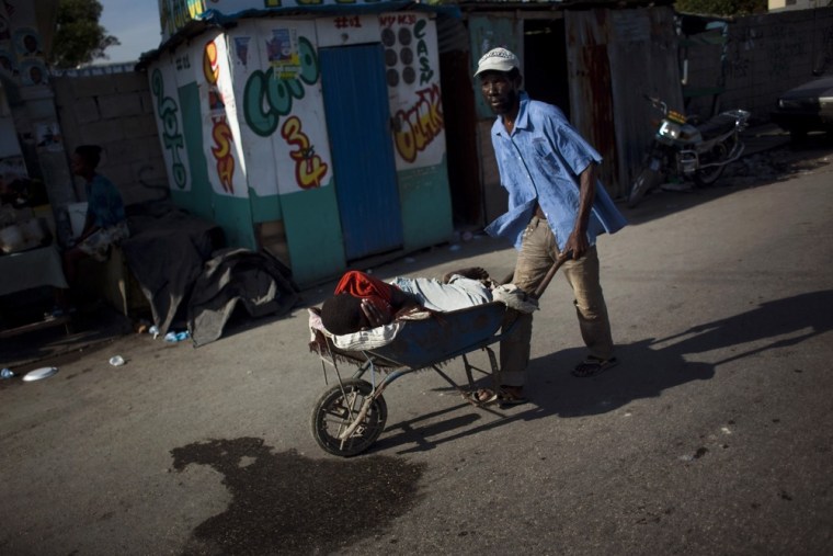 Image: Man taking boy with cholera symptoms to hospital