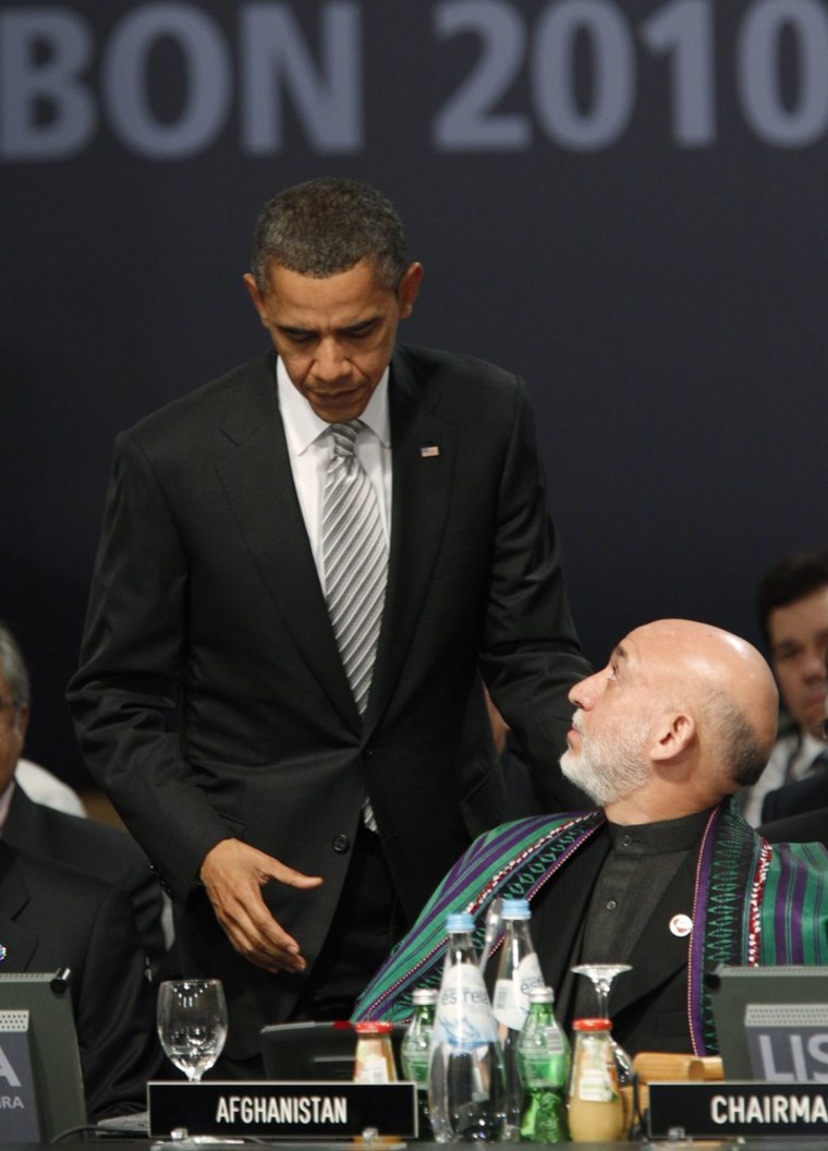 Image: U.S. President Barack Obama greets Afghanistan's President Hamid Karzai at the NATO Summit in Lisbon