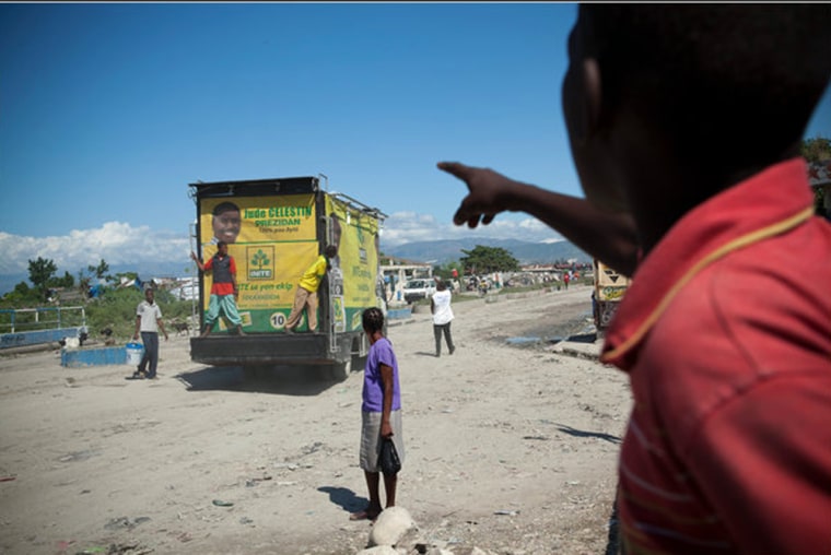 A truck playing dance music and campaign songs in support of the current president’s preferred successor, Jude Celestin, drove through Port-au-Prince. The president, René Préval, has been criticized for his response to the January earthquake.