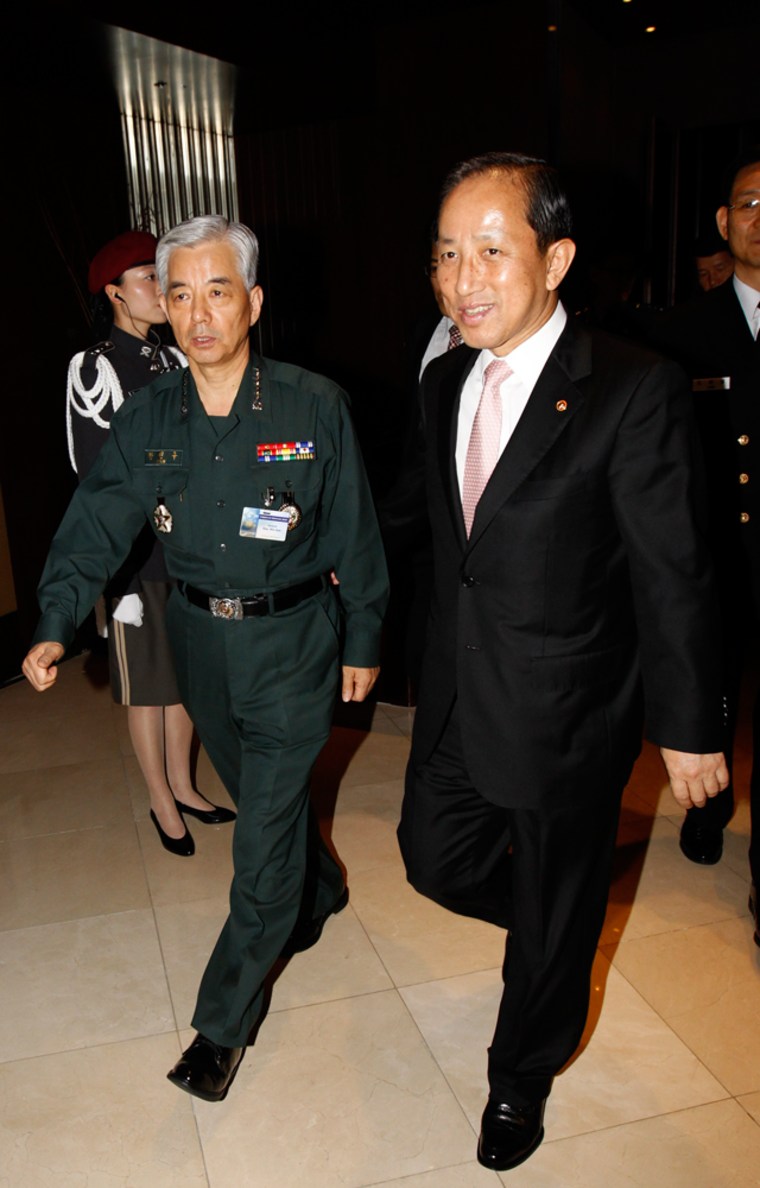 Image: South Korean Defence Minister Kim and General Han, chairman of South Korean Joint Chiefs of Staff, walk upon Kim's departure after his keynote speech during the 13th CHOD conference at a hotel in Seoul