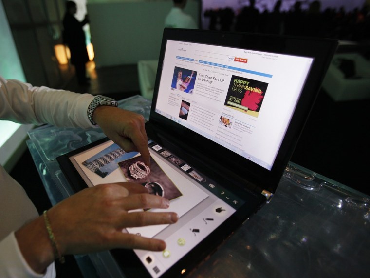 Image: The Acer ICONIA, which has two all-point multi-touch displays, is seen during a news conference in New York