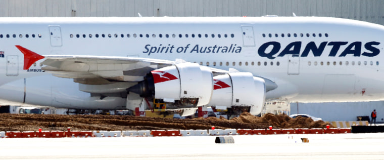 Image: A Qantas A380 jumbo jet sits idle on the tarmacc