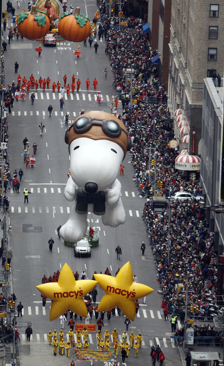 Image: Balloons pass through Times Square during the 84th annual Macy's Thanksgiving Day parade in New York
