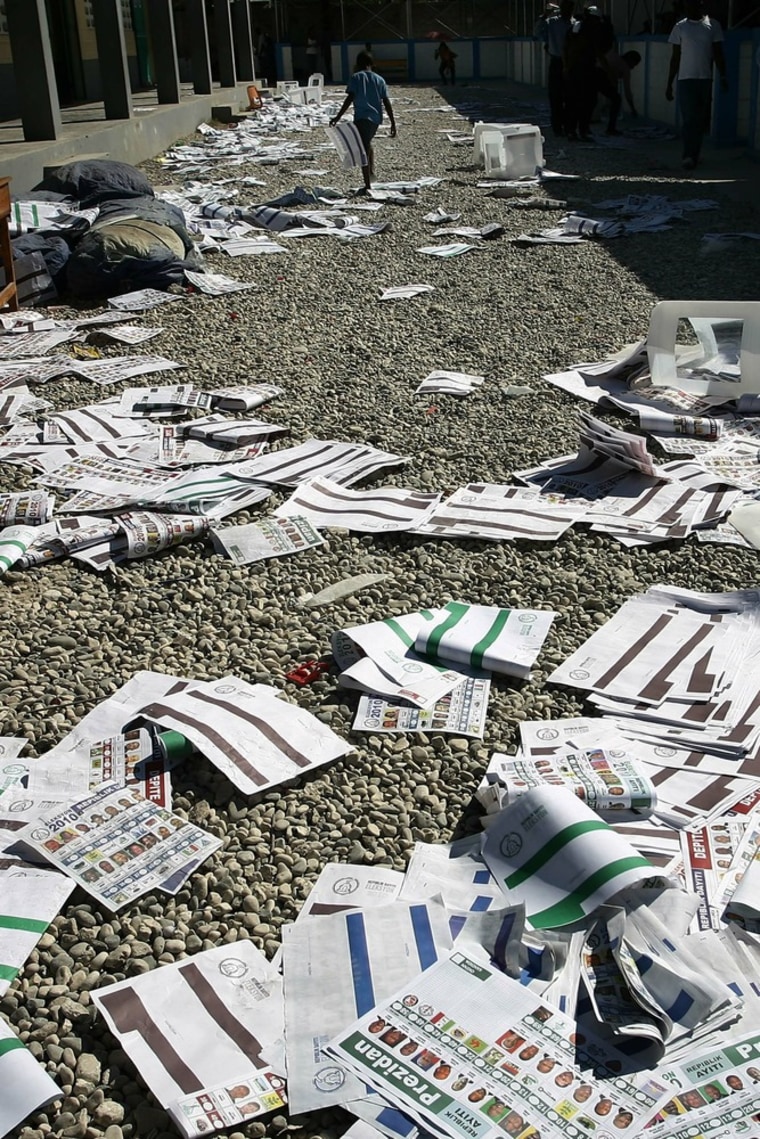Image: Crushed voting boxes and slips lay on th