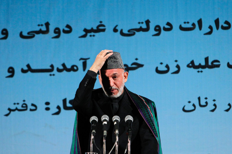 Image: Afghan President Hamid Karzai speaks during a conference in Kabul