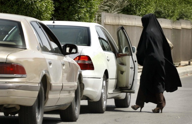 Image: A female teacher leaves a school by car in the capital Riyadh, Saudi Arabia