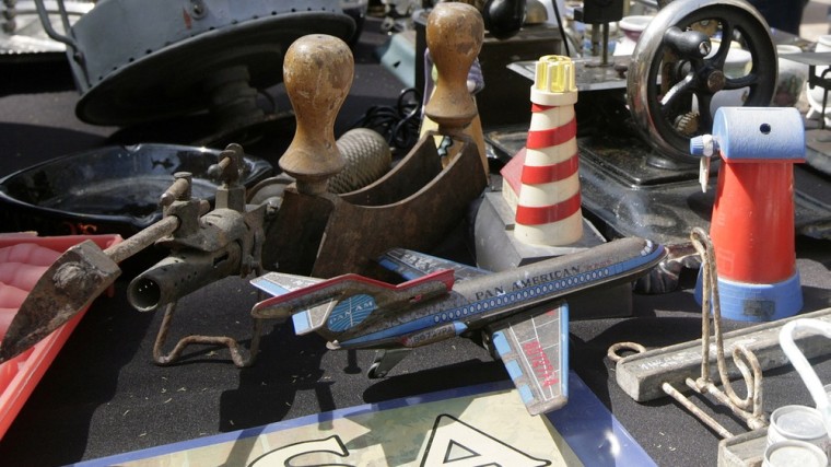 Image: People look at antiques at a street market during Heritage Day celebrations in downtown Montevideo
