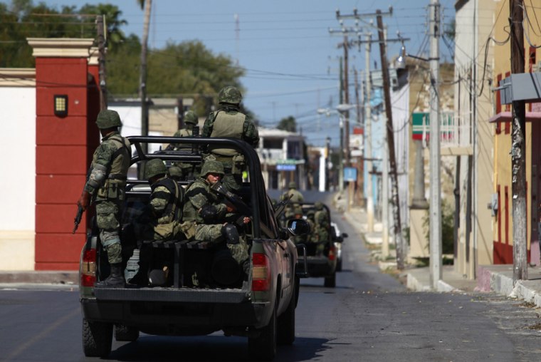 Image: Mexican army soldiers patrol the streets in Ciudad Mier